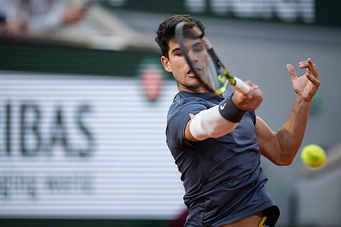 Carlos Alcaraz plays a shot against Greece's Stefanos Tsitsipas
